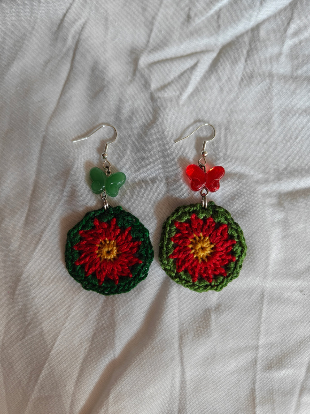 Crochet flower and glass butterfly earrings