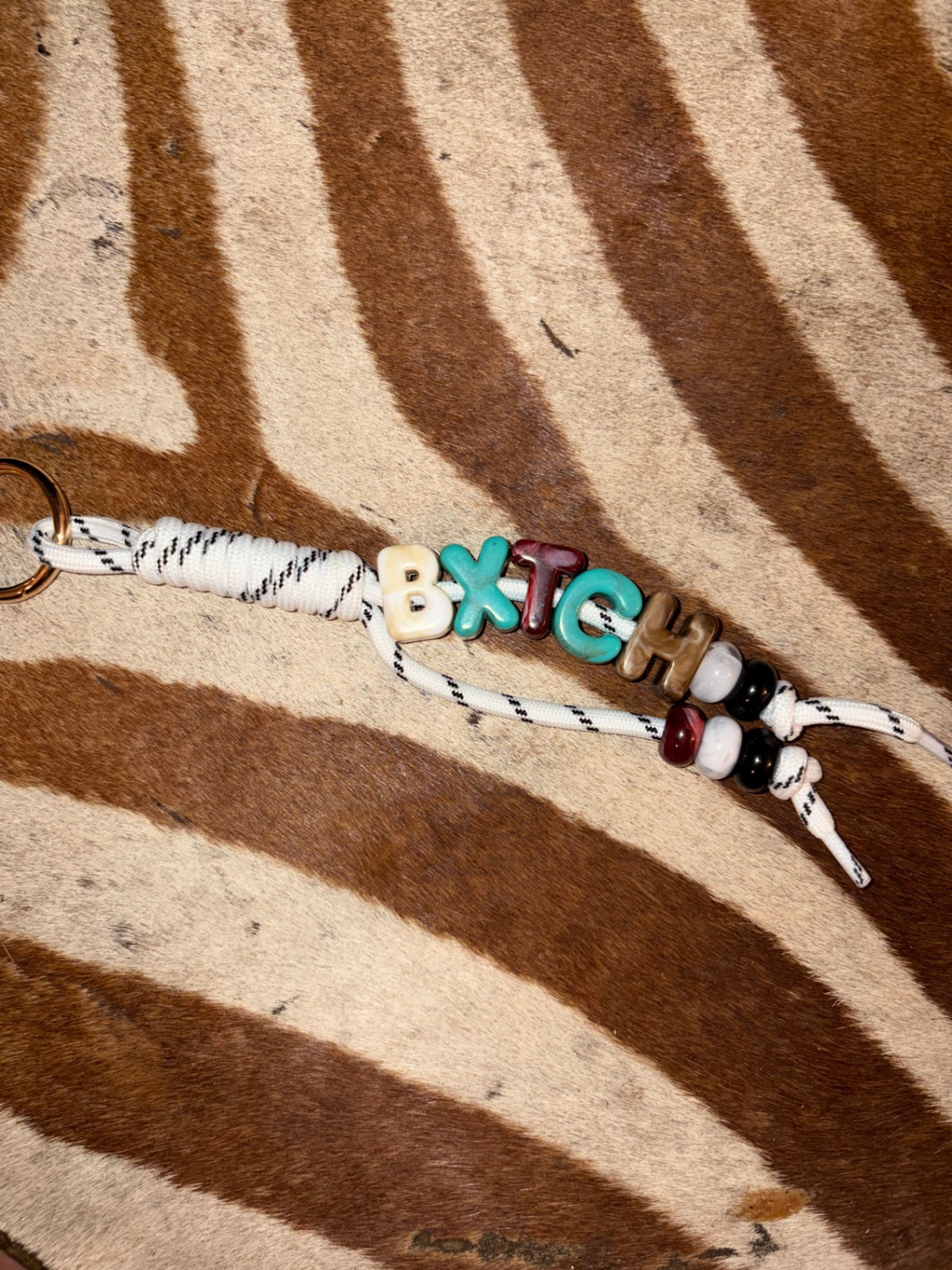 ‘Bxtch’ bag charm